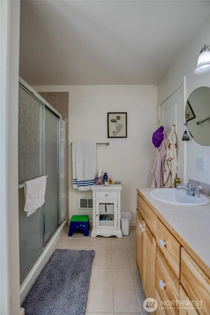 Tile floor and nice-size shower.