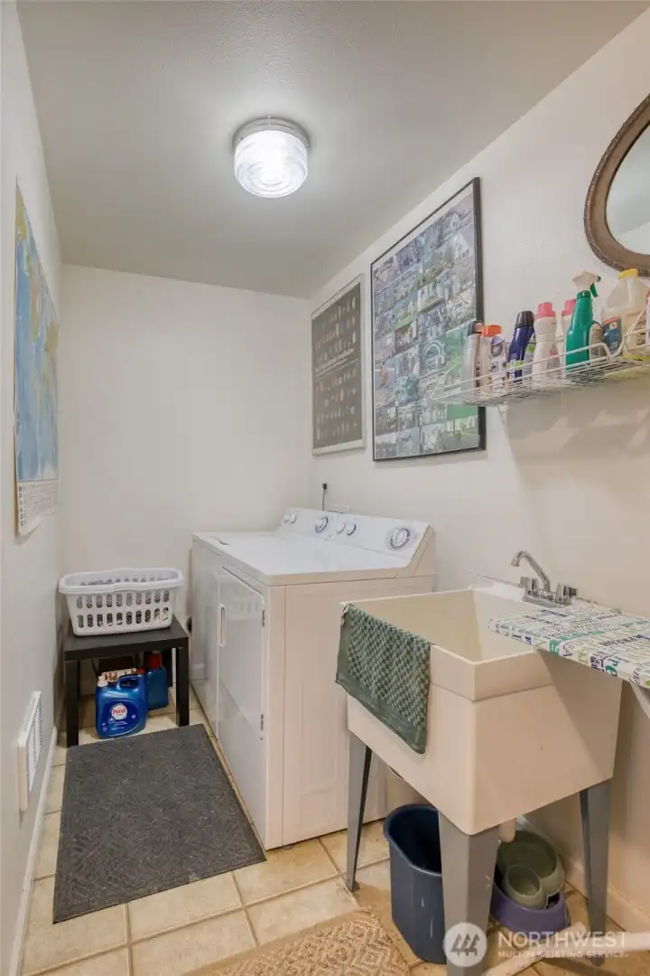 Also downstairs is the large utility room.