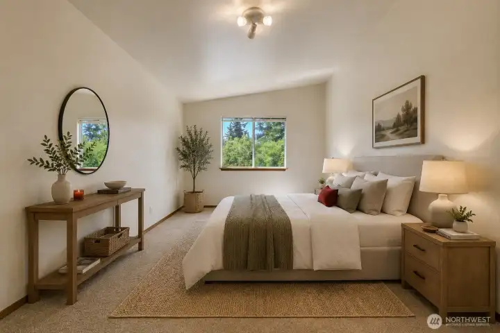 Primary bedroom with vaulted ceilings vitually staged.