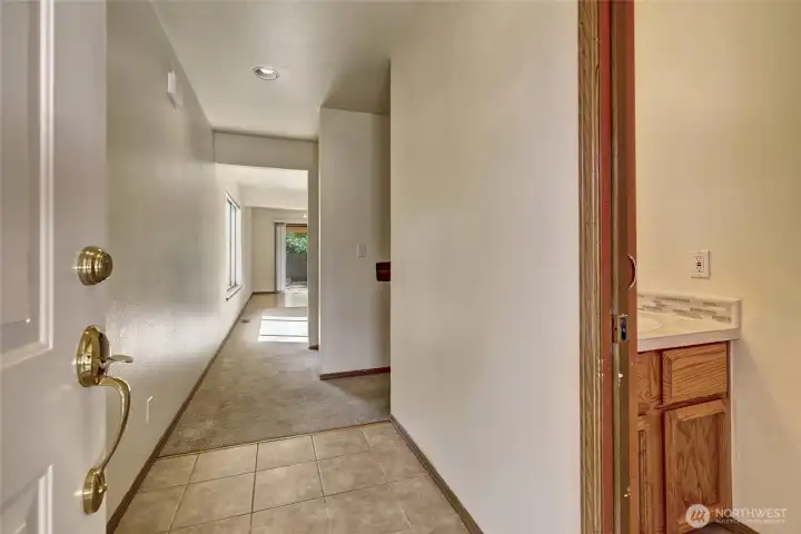 Entry hallway with powder-room & garage access to the right