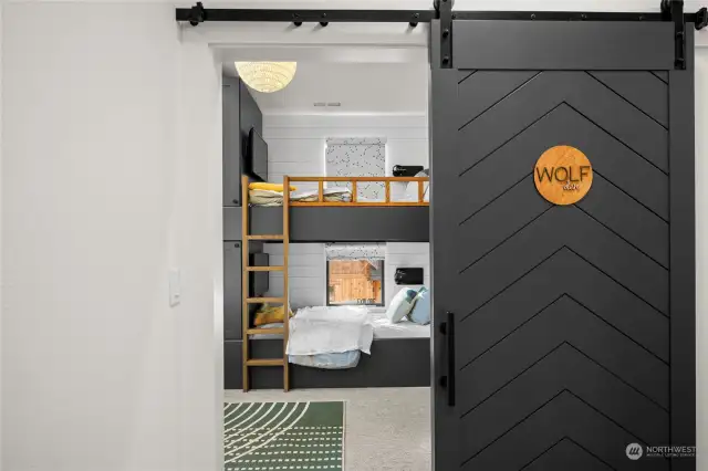 The Wolf Den bunk room sleeps 4 with built in bunks that feature individual TVs with wireless headphones.