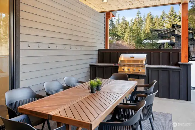 The covered patio seats 8 and has a built in BBQ. Outdoor dining at its best!