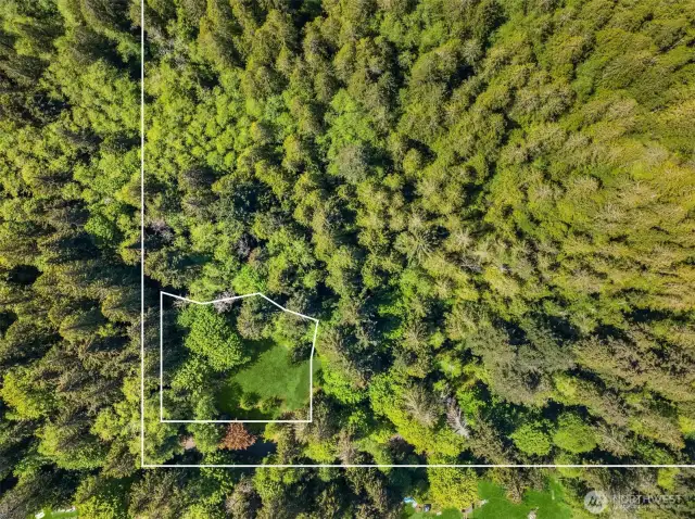 Interior outline shows approximate building site.