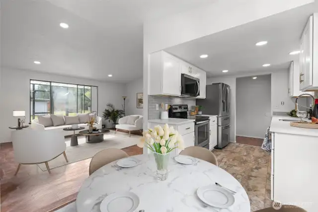 dining area leading to kitchen and living area