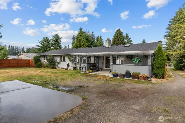 Back of house with patio