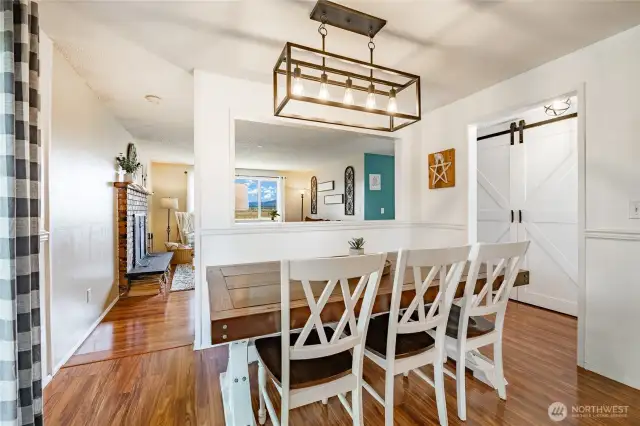 Dining Room with a glimpse of the pantry in hall (barn doors)