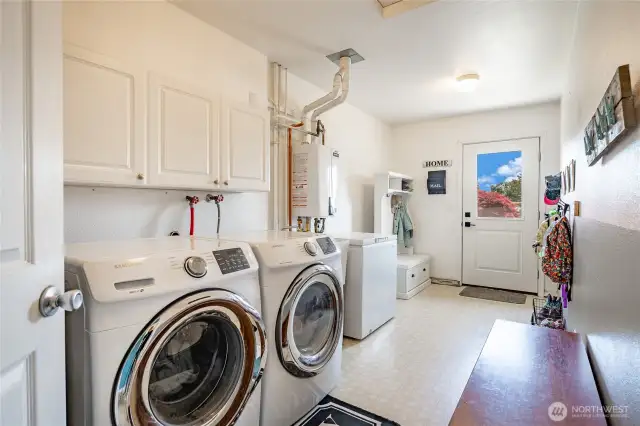 Laundry/Utility Room with access door to driveway