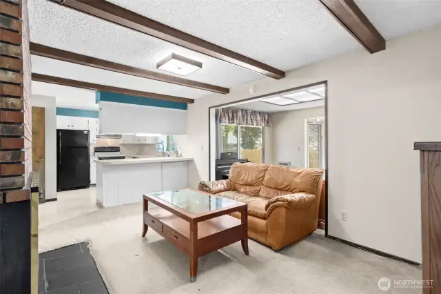 Family Room with bonus room off kitchen w/fireplace