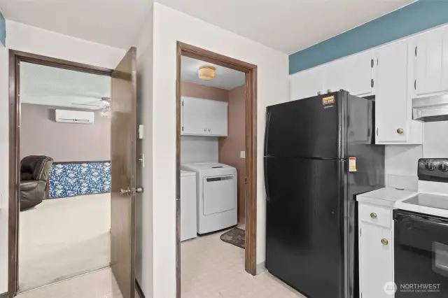 Laundry Room off Kitchen and door to formal living room.