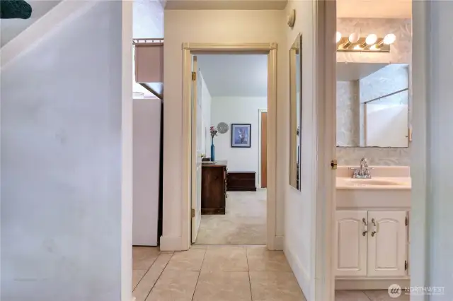 Hallway to downstairs primary bedroom.