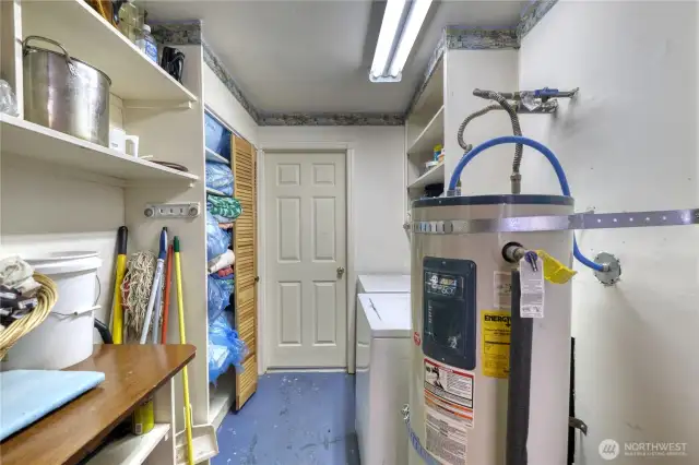 Utility Room with Washer and Dryer. Door leads to Garage and Bonus Room above the Garage.