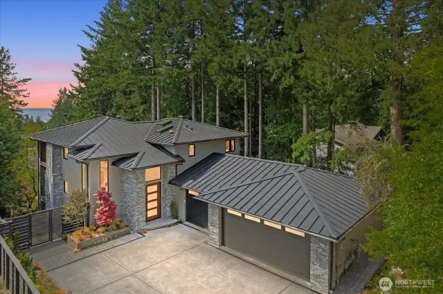Complemented by a 924 SF three-car garage with heated floors, skylights, and versatile flex space—engineered for future expansion with full-stack plumbing and structural beams already in place.
