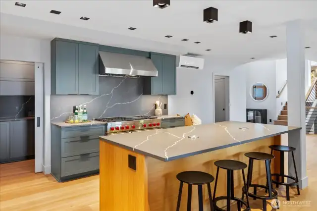 Designer lighting, custom cabinetry, quartz countertops, and artisanal tile work
