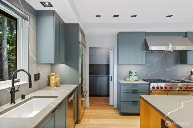 Designed for entertaining and multi-generational living, dual gourmet kitchens on the main and lower levels feature a $120K collection of Sub-Zero, Wolf, Bosch, Zephyr, and LG appliances—ensuring effortless hosting on any scale.