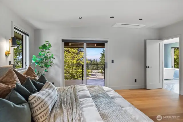 Primary bedroom retreat has its own covered & heated balcony