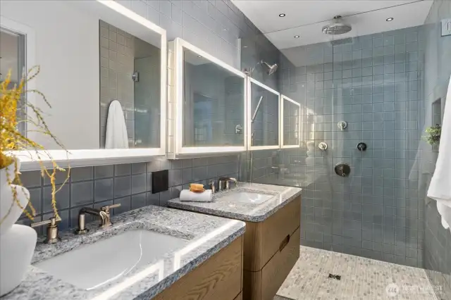 From designer tilework to Robern cabinetry and Kohler fixtures, every bath reflects thoughtful luxury and timeless design.