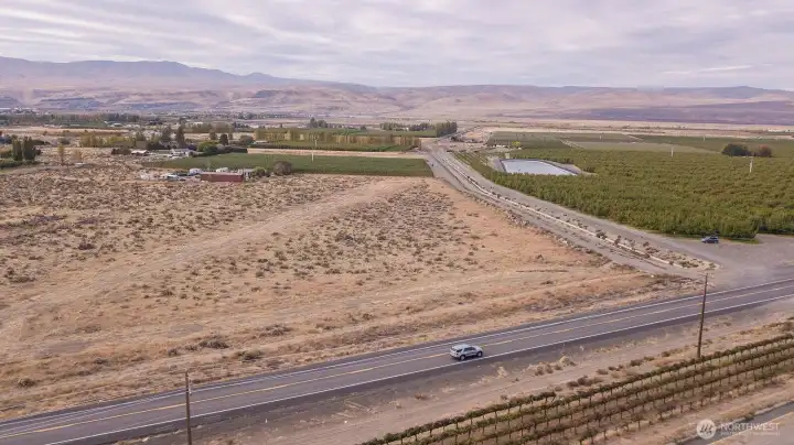Aerial view of the 243 Highway and the SE corner of the property and water canal.
