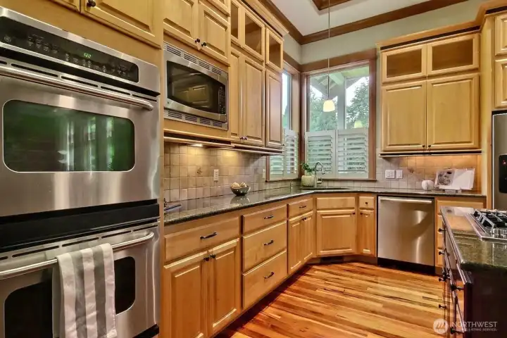 Spacious gourmet kitchen with stainless steel appliances including double ovens, so much storage & walk in closet