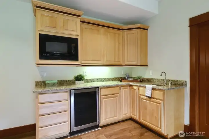 Kitchenette on lower level with wine cooler