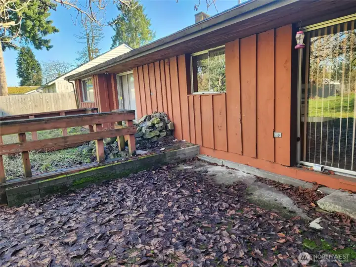 Back left side of home. Sliding glass door on either side of the kitchen gives you convenient access to the backyard.