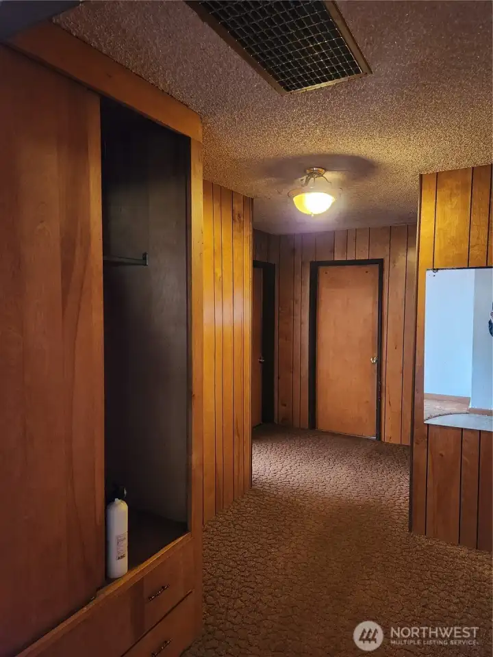 Entrance to 3 bedrooms and full bath, off Entry, with built in for added storage