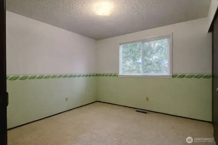 Second bedroom on the upper level.  Nice sized, with double window.