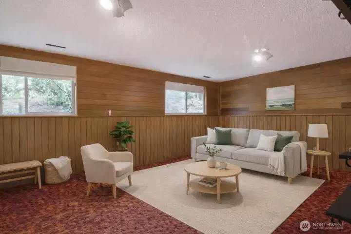 This is a virtually staged version of the groovy rec room.  A pool table could work well here, too...