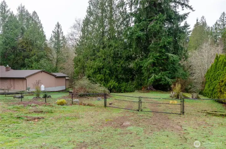 The adjoining lot is included in the sale.  It may or may not work for you as a building site due to setback and buffer restrictions, but what an addition to the property.  Garden space, play area, or just for more privacy, this lot is a bonus for sure!