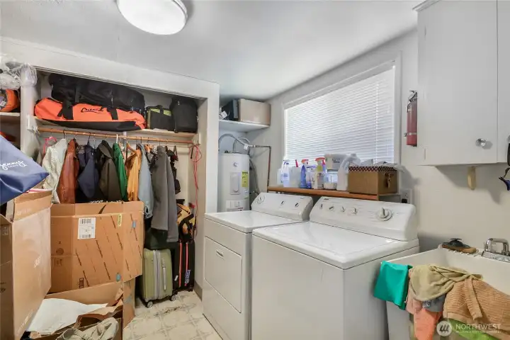 Roomy Laundry w/utility sink & storage space