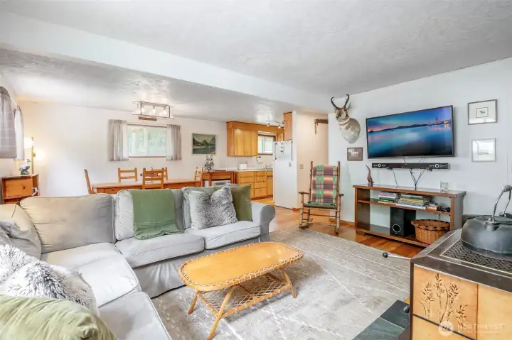 Open-concept living room, dining room, and kitchen provides great flow and is ideal for entertaining.