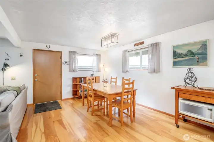 Multiple windows provide natural light, wooded views, and nature-connected ambiance. Bonus- they're also energy-efficient, and vinyl double-pane!