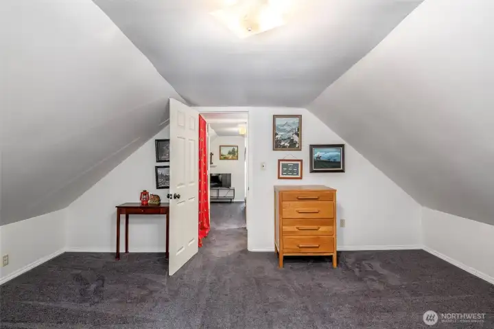 Oversized bedroom offers additional room for a home office or seating area.