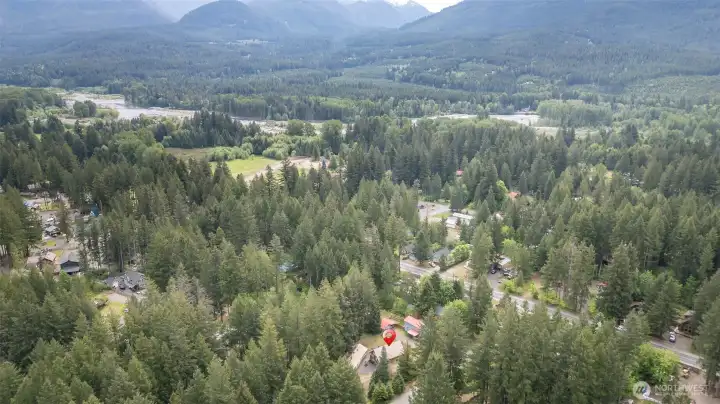 Expansive aerial view of Packwood and the surrounding valley—nestled between mountains and rivers, this is the quintessential Pacific Northwest mountain town.