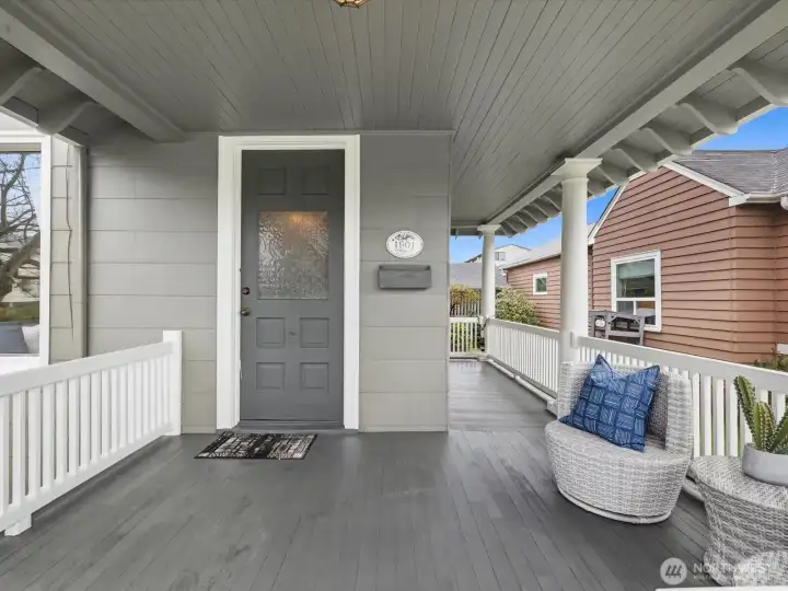 Notice the beautiful, original front door and the architectural detail of this classic home.