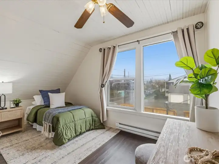 Each of the three bedrooms on the upper level are good sized and include more large windows.