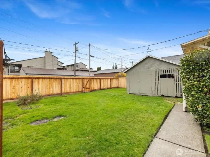 The back yard is fully fenced.