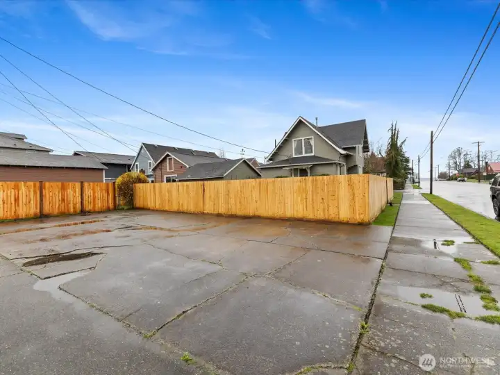 This is the large parking space off of the alley, big enough for your vehicles and RV. A gate leads to the backyard.