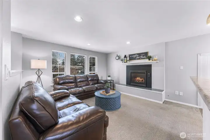 Large windows in the living room let in tons of natural light