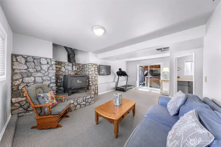 Private access through slider to exterior covered storage area under deck and to back yard oasis