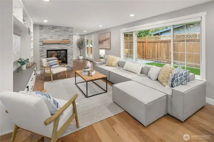 spacious living room with double sided fireplace that is a focal point for the formal dining room and living room. spacious living room with double sided fireplace that is a focal point for the formal dining room and living room.