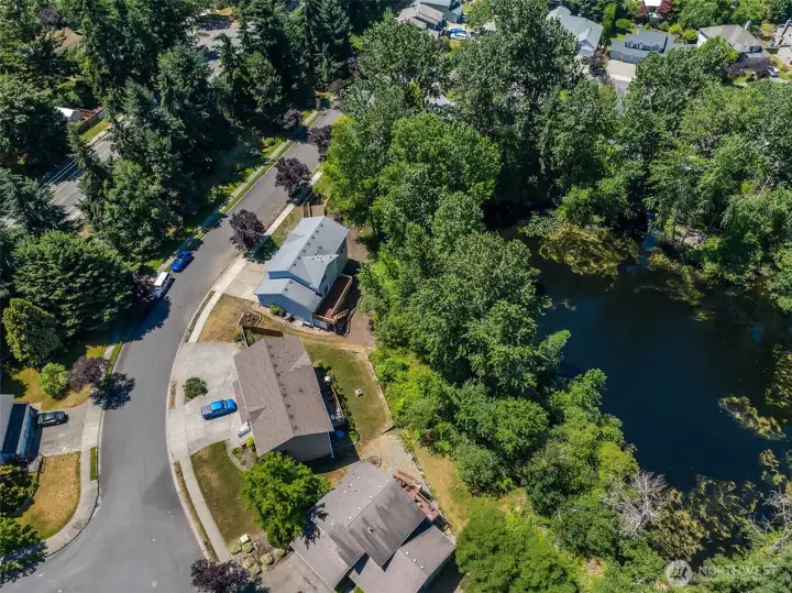 This home is beautifully situated on a spacious lot, with no neighbors on the left, and a serene pond out back...