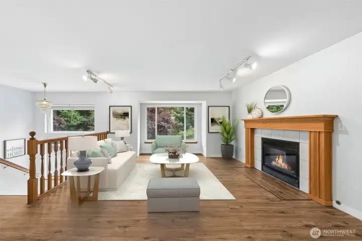 Enjoy gathering in the light & bright Family Room, with large picture windows. (Virtually staged).