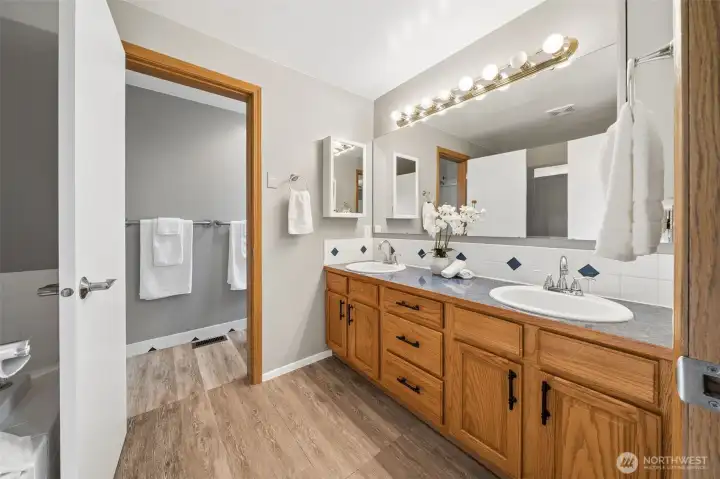Primary Bath is spacious w/dual sinks and great storage.