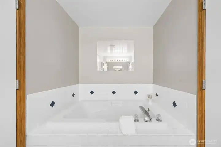 The Primary Bath features a large soaking tub, already wired for jets.