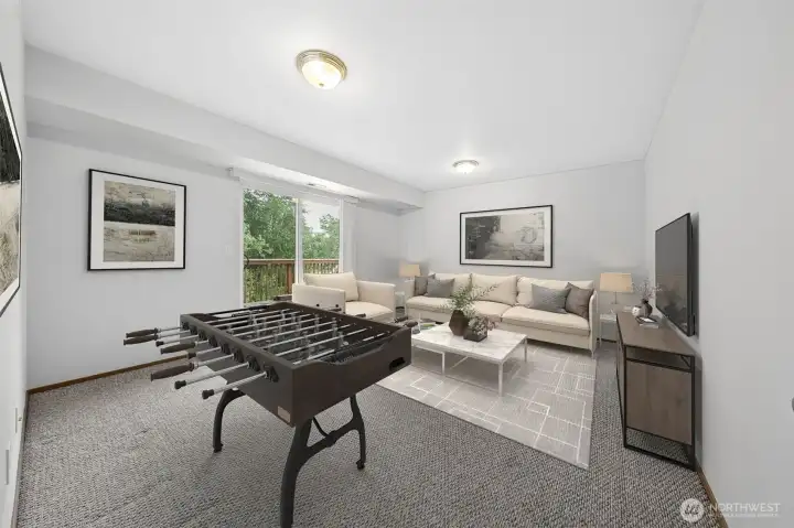 Bonus Room located on the lower floor, with access to the beautiful Trex deck. (Virtually staged).