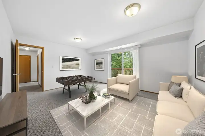 The Bonus Room is a great size & super versatile. (Virtually staged).
