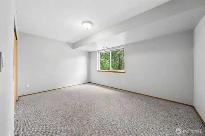Bedroom #5, located on the lower floor, overlooking the backyard.