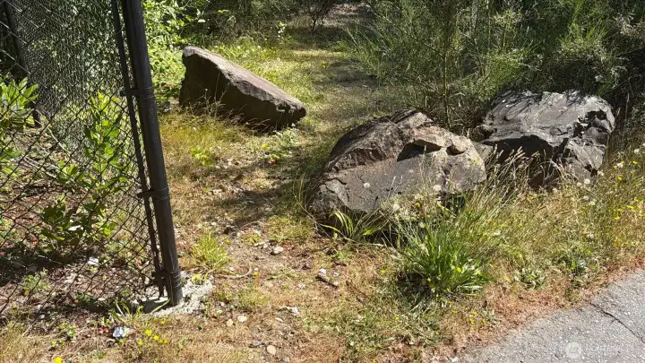 This chain link corner post is the NE corner of the property. This chain link corner post is the NE corner of the property.