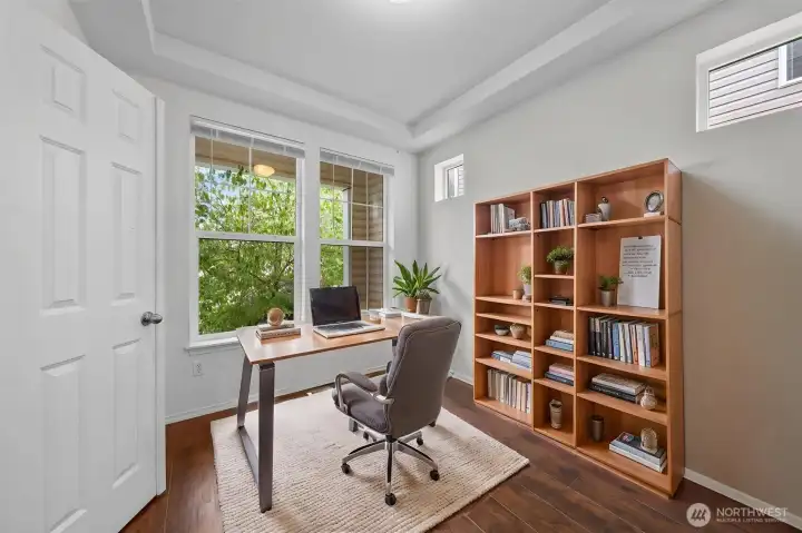 Virtually staged office/den off entry Virtually staged office/den off entry