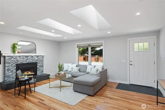 Living room with propane fireplace and skylights